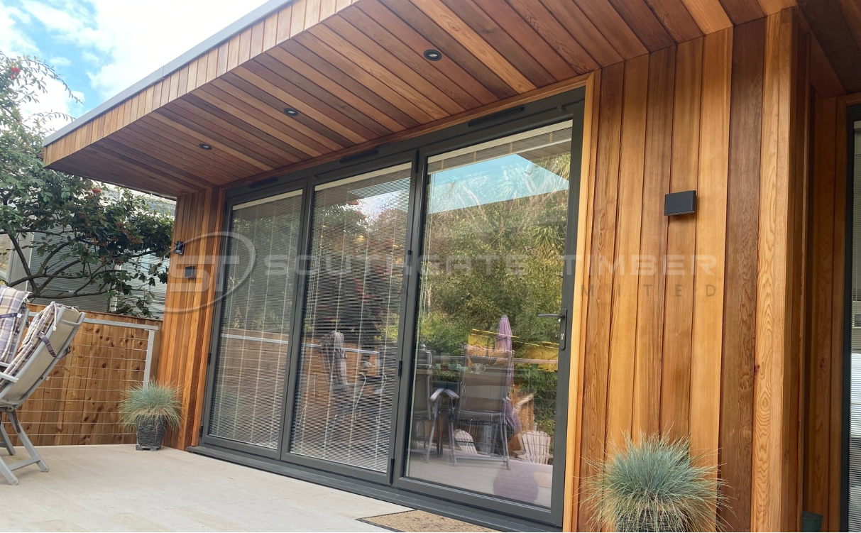 Finished garden building clad in Western Red Cedar, showcasing the natural appearance and long-term performance of timber supplied by Southgate Timber.